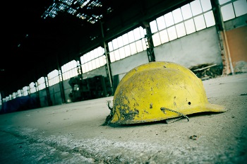 yellow hard hat on factory floor